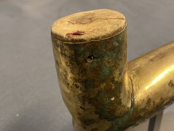 A Tibetan gilt bronze and copper alloy arm of Buddha, Ming