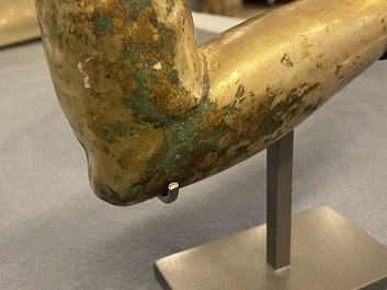 A Tibetan gilt bronze and copper alloy arm of Buddha, Ming