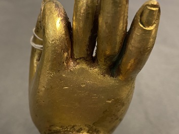 A Tibetan gilt bronze and copper alloy arm of Buddha, Ming