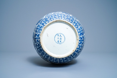 A Chinese blue and white 'hu' vase with floral design, Qianlong mark, 19th C.