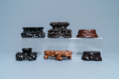 Twelve Chinese carved wooden stands, 19/20th C.