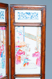 A Chinese wooden four-fold screen with famille rose plaques, 19th C.