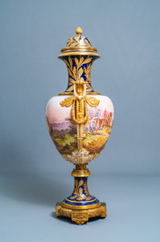 A pair of massive French S&egrave;vres-style vases with gilt bronze mounts, signed Desprez, 19th C.