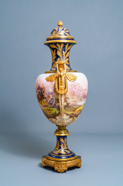 A pair of massive French S&egrave;vres-style vases with gilt bronze mounts, signed Desprez, 19th C.