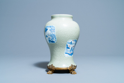 Een Chinese celadon vaas met blauw-witte en koperrode panelen, Kangxi