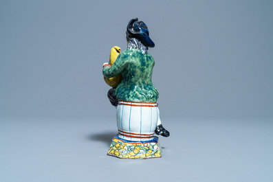 A polychrome Dutch Delft figure of a bagpipe player, 18th C.