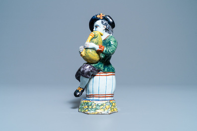 A polychrome Dutch Delft figure of a bagpipe player, 18th C.