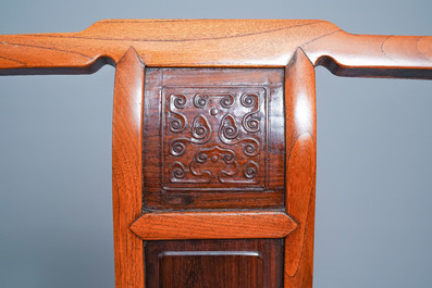 A Chinese wooden chair with inserted carved panels, 19th C.