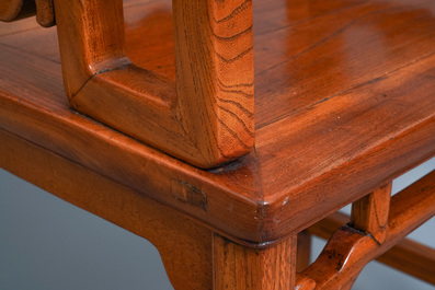 A Chinese wooden chair with inserted carved panels, 19th C.