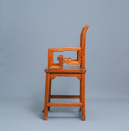 A Chinese wooden chair with inserted carved panels, 19th C.