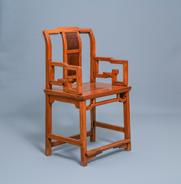 A Chinese wooden chair with inserted carved panels, 19th C.