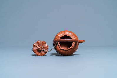 A Chinese Yixing stoneware chrysanthemum-shaped teapot and cover, Yongzheng/Qianlong