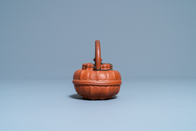 A Chinese Yixing stoneware chrysanthemum-shaped teapot and cover, Yongzheng/Qianlong