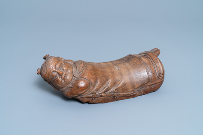 A Chinese bamboo 'recumbent boy' pillow, 19th C.