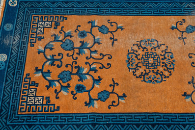 A large Chinese rectangular carpet, 19th C.