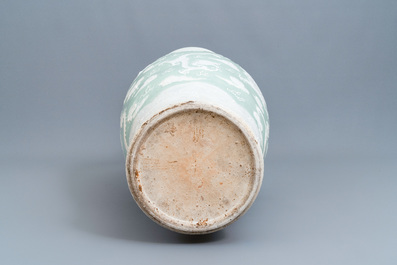 A massive Chinese relief-decorated celadon-ground 'dragon' vase, 19th C.