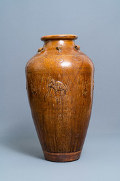 A large Chinese brown-glazed relief-molded and incised martaban jar, Qing