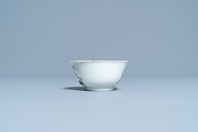 A Chinese blue and white cup and saucer with a design after Cornelis Pronk, Yongzheng/Qianlong