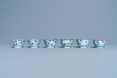 Six Chinese blue, white and copper red cups and saucers, Kangxi