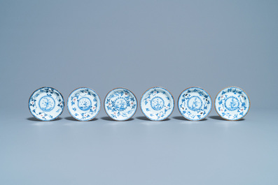 Six Chinese blue, white and copper red cups and saucers, Kangxi