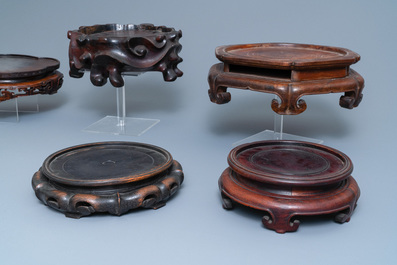 Seven large Chinese carved wooden stands, 19/20th C.