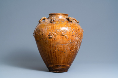 A large Chinese brown-glazed relief-molded martaban jar with Buddhist lions, Ming