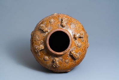 A large Chinese brown-glazed relief-molded martaban jar with Buddhist lions, Ming