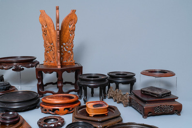 A varied collection of ca. 50 Chinese carved wooden stands, 19/20th C.