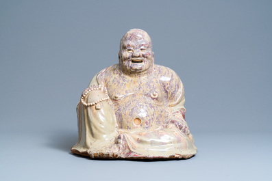 A massive Chinese flamb&eacute;-glazed Shiwan pottery figure of Buddha, 18/19th C.