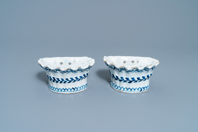 A pair of blue and white French faience bouqueti&egrave;res or wall flower holders, Lille, 18th C.