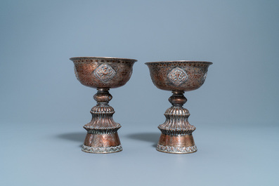 A pair of Tibetan silvered copper alloy altar bowls, 19/20th C.