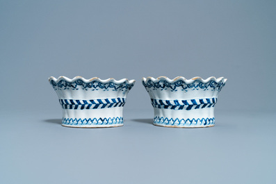A pair of blue and white French faience bouqueti&egrave;res or wall flower holders, Lille, 18th C.