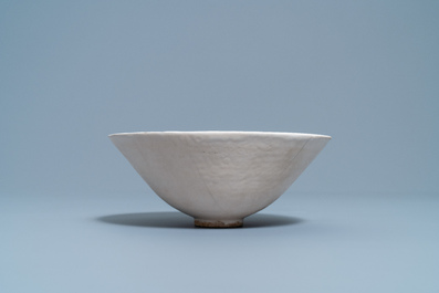 A Chinese luanbai bowl with molded design of characters and floral sprigs, Yuan