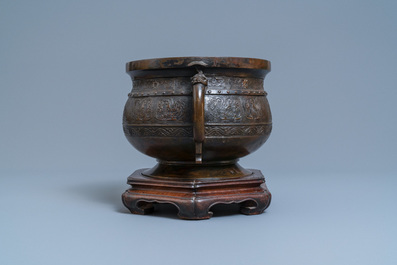 A large Chinese bronze 'Gui' vessel on hardwood stand, Yuan