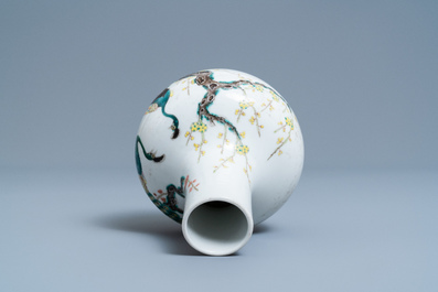 A Chinese famille rose bottle vase with peacocks, Qianlong mark, 19th C.