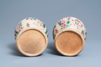 A pair of Chinese Nanking famille rose crackle-glazed 'court scene' vases, 19th C.