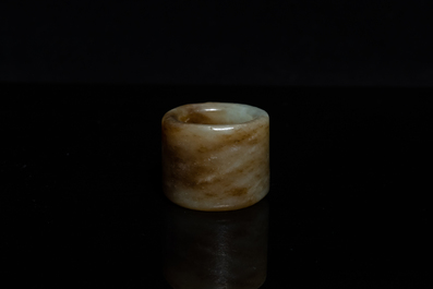 A Chinese mottled celadon jade archer's ring, Ming