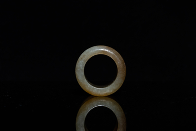 A Chinese mottled celadon jade archer's ring, Ming