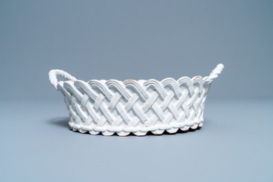 A white Delftware basket, a lobed dish, a spice box and a sauce boat, 18th C.