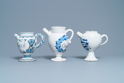 Three blue and white Dutch Delft, Nevers and Rouen wet drug jars and four jugs, 17/18th C.