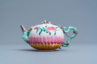 A Chinese famille rose teapot on stand with applied floral design, Yongzheng