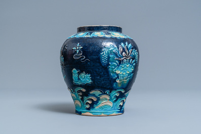 A Chinese fahua vase with mandarin ducks in a lotus pond, Ming