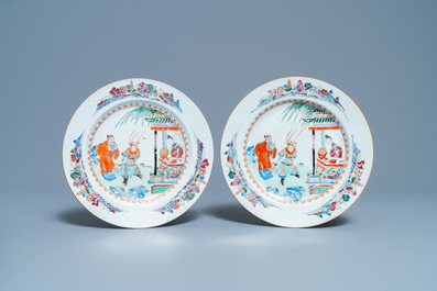 A pair of Chinese famille rose plates with figures in a garden, Yongzheng/Qianlong