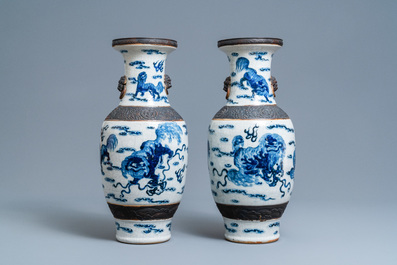 A pair of Chinese blue and white Nanking crackle-glazed vases with Buddhist lions, 19th C.