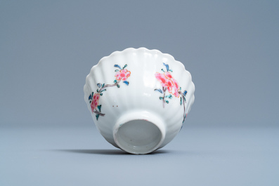 A lobed Chinese famille rose cup and saucer with floral design, Yongzheng