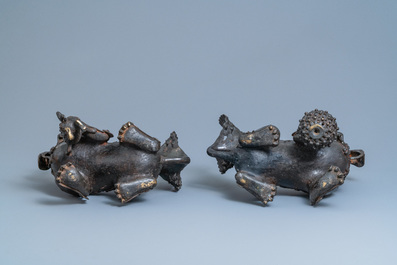 A pair of large Chinese bronze models of Buddhist lions, Ming