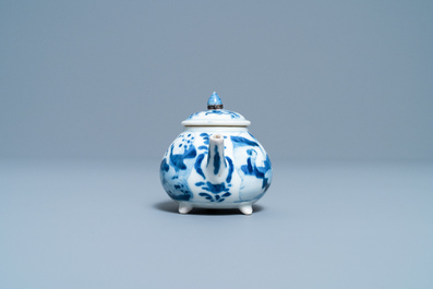 A Chinese blue and white tripod teapot with figures in a landscape, Kangxi