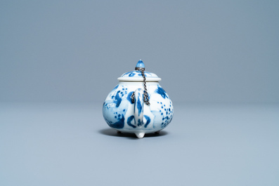 A Chinese blue and white tripod teapot with figures in a landscape, Kangxi