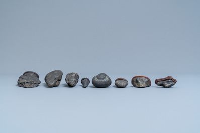 Eight Chinese scholar's rocks on wooden stands, 19/20th C.