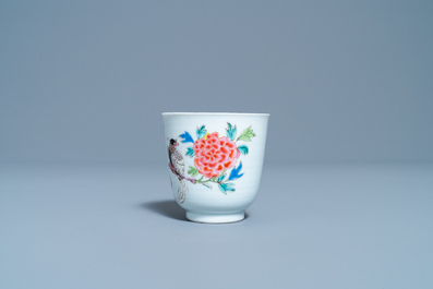 A Chinese famille rose cup and saucer with a bird on a blossoming branch, Yongzheng